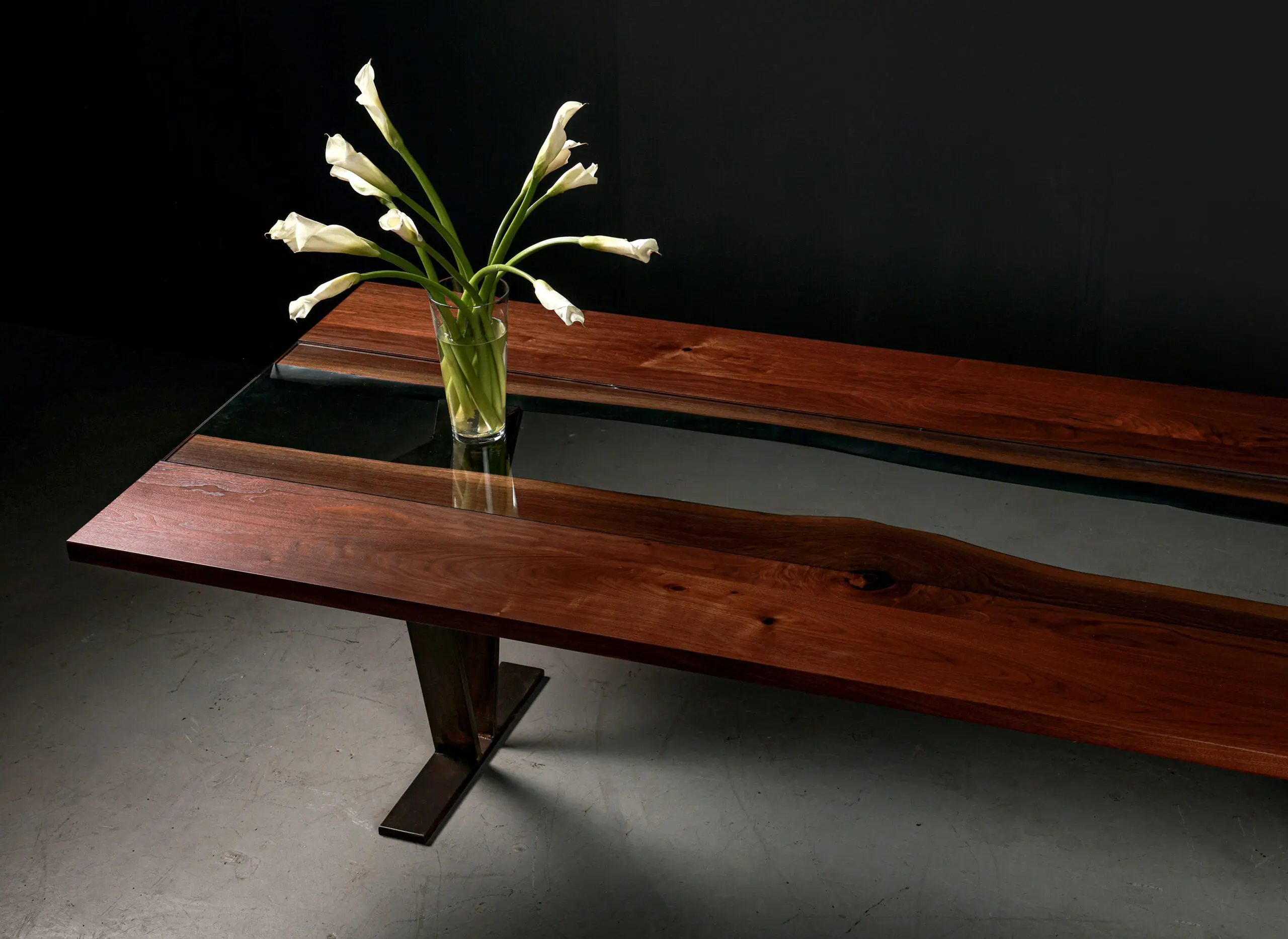 Colorado River dining table in solid maple with blackened steel wishbone legs