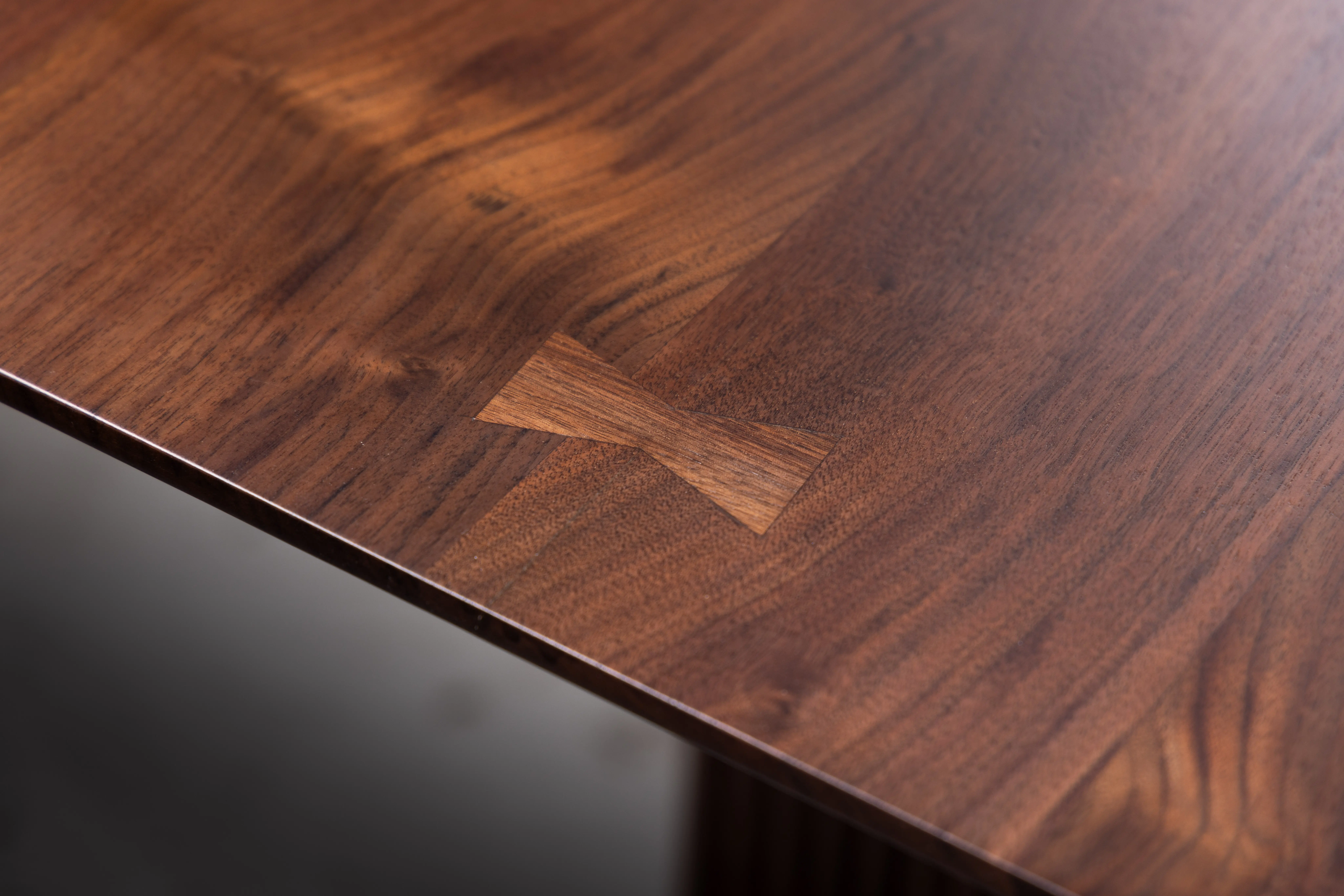modern waterfall dining table in black American walnut with elegant finish