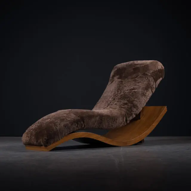 A luxurious lounge chair with a sheepskin seat cover on a wavy wooden base, blending comfort with unique design.