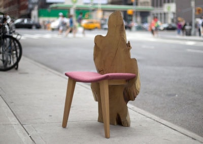 Locust live edge chair with sculptural wood slab back, handcrafted by Sentient Furniture