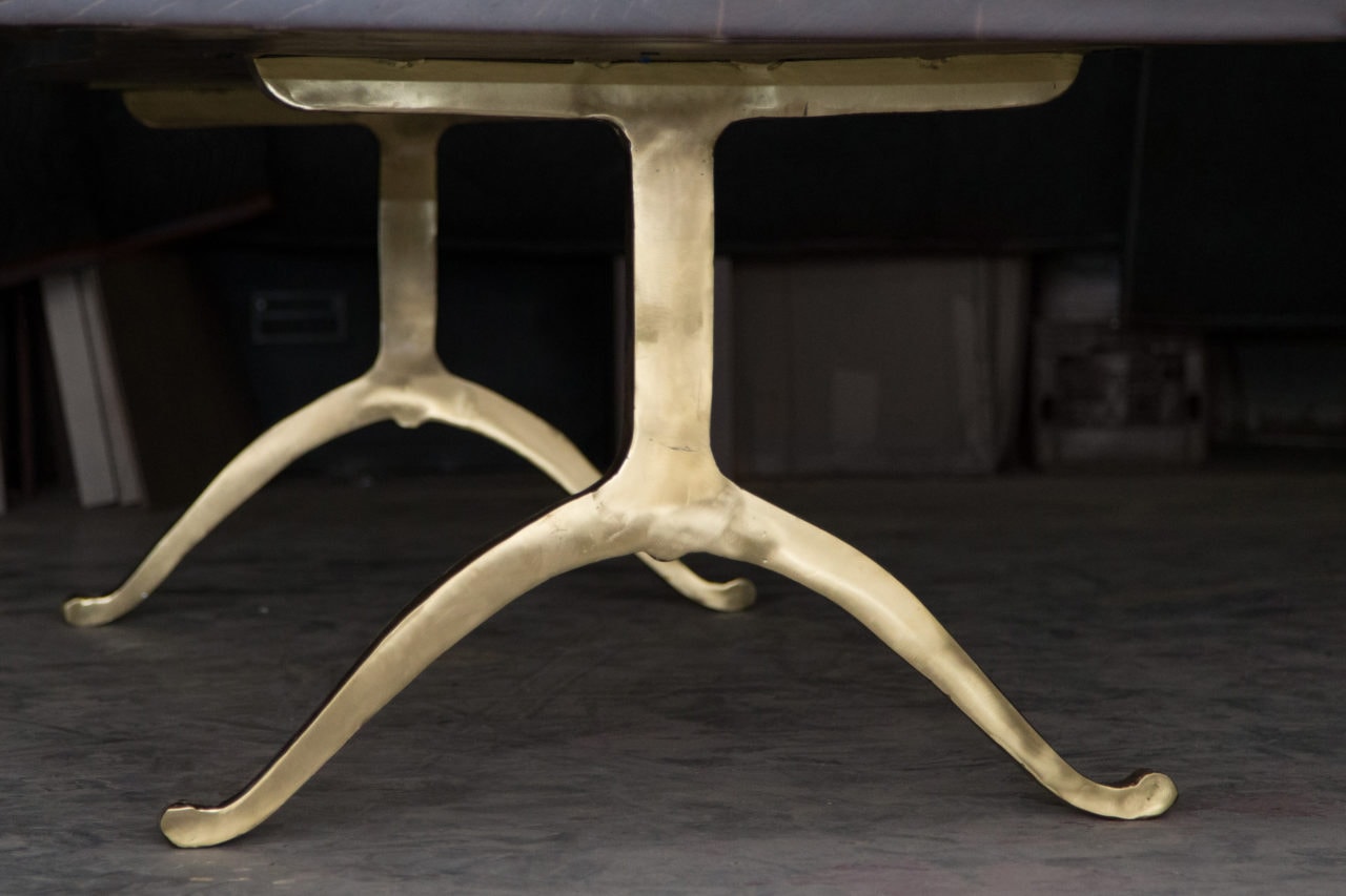 an American black walnut solid live edge luxury SENTIENT custom table with polished brass metal wishbone legs