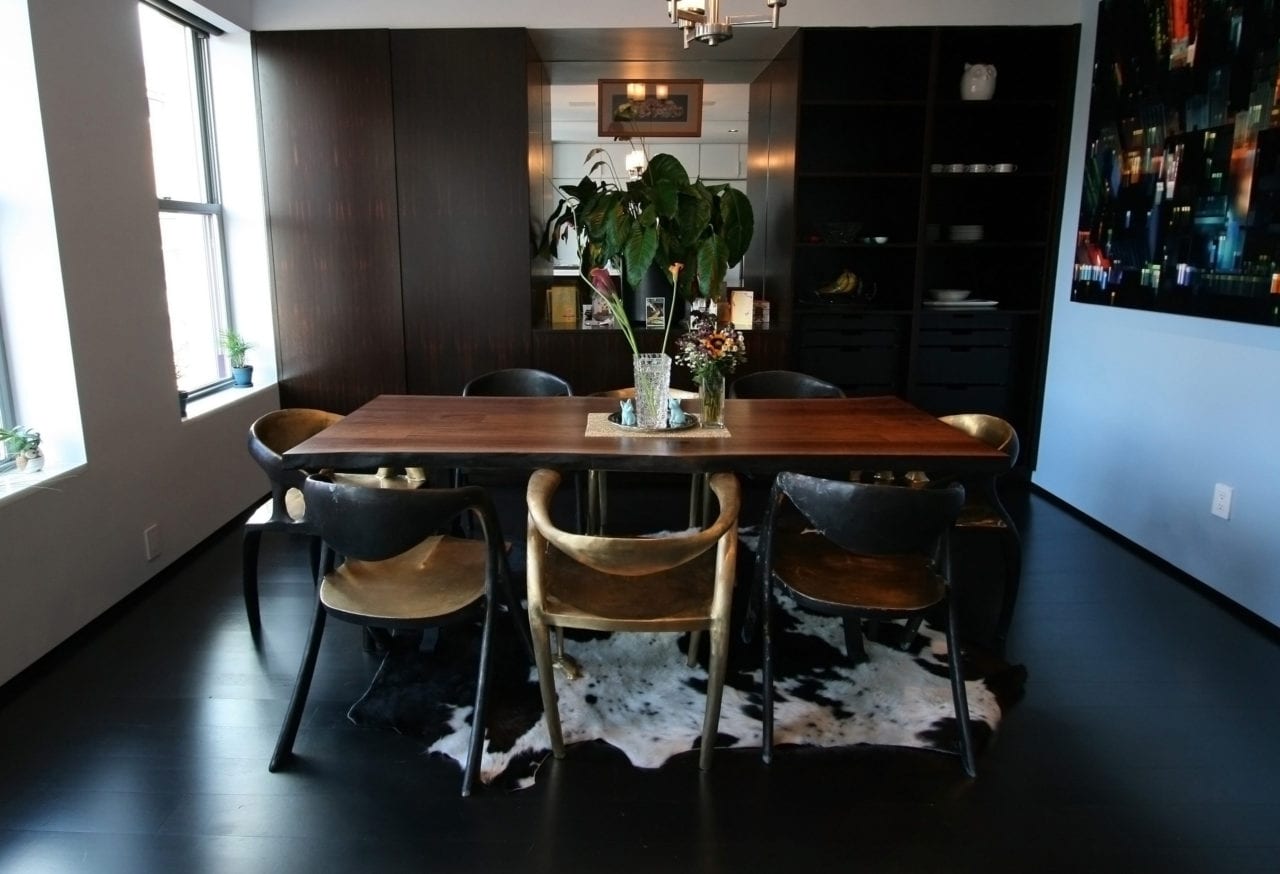 a SENTIENT contemporary designed custom live edge walnut table in dining room