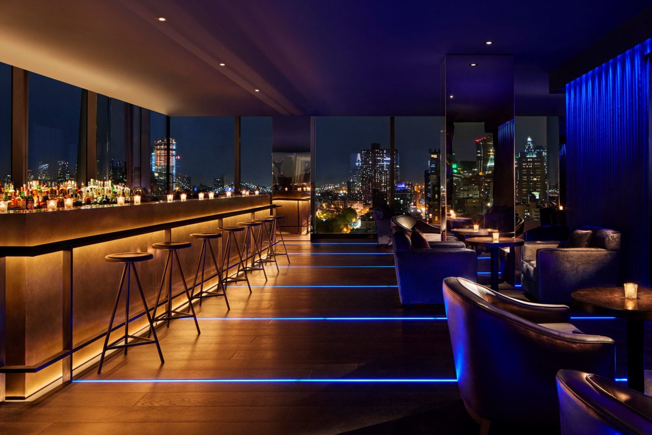 a view of the bar at the public hotel in New York with custom SENTIENT contemporary designed furniture 
