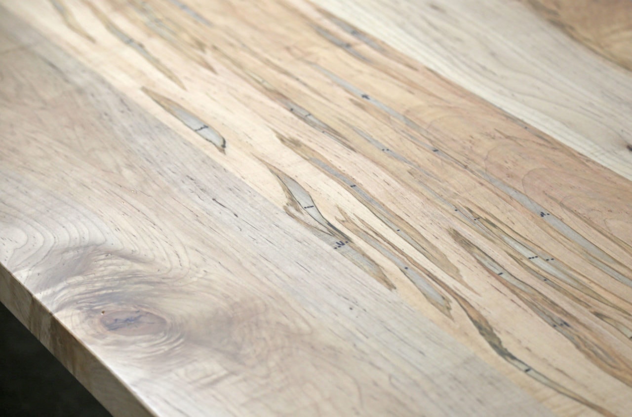 a SENTIENT contemporary designed ambrosia maple communal table top detail 