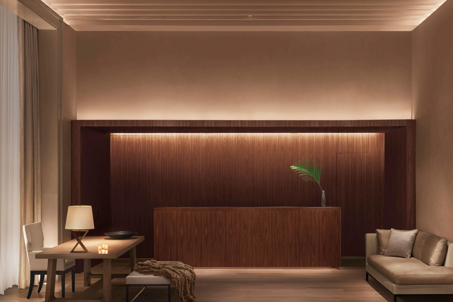 a lobby view of the  New York edition hotel with SENTIENT contemporary designed custom luxury furniture and wood inset wall