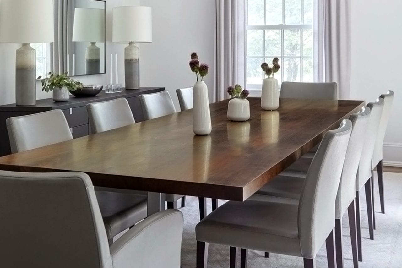 a SENTIENT contemporary designed live edge wood table with luxury upholstered chairs in dinning room setting 