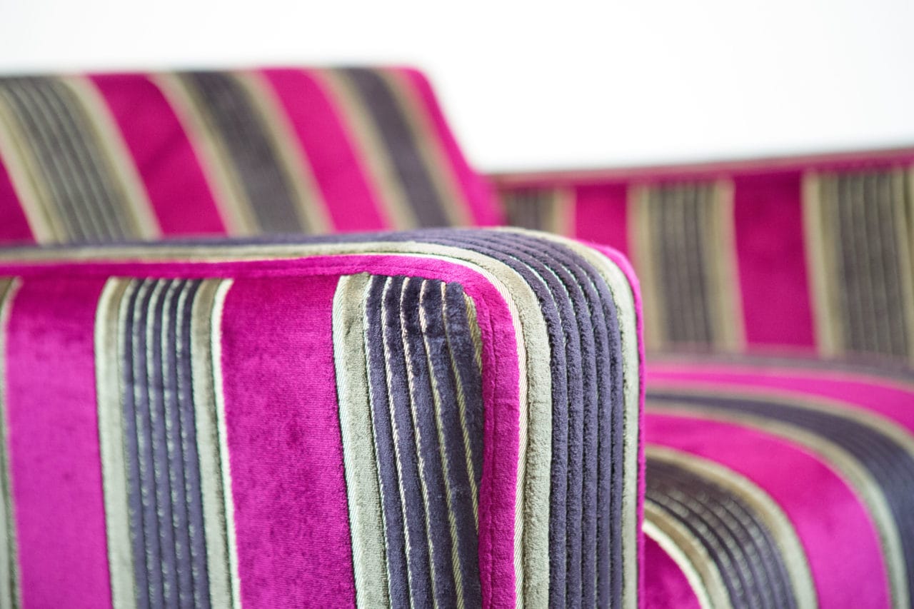 arm detail of SENTIENT contemporary designed luxury upholstered custom chair stripped fabric for British airways
