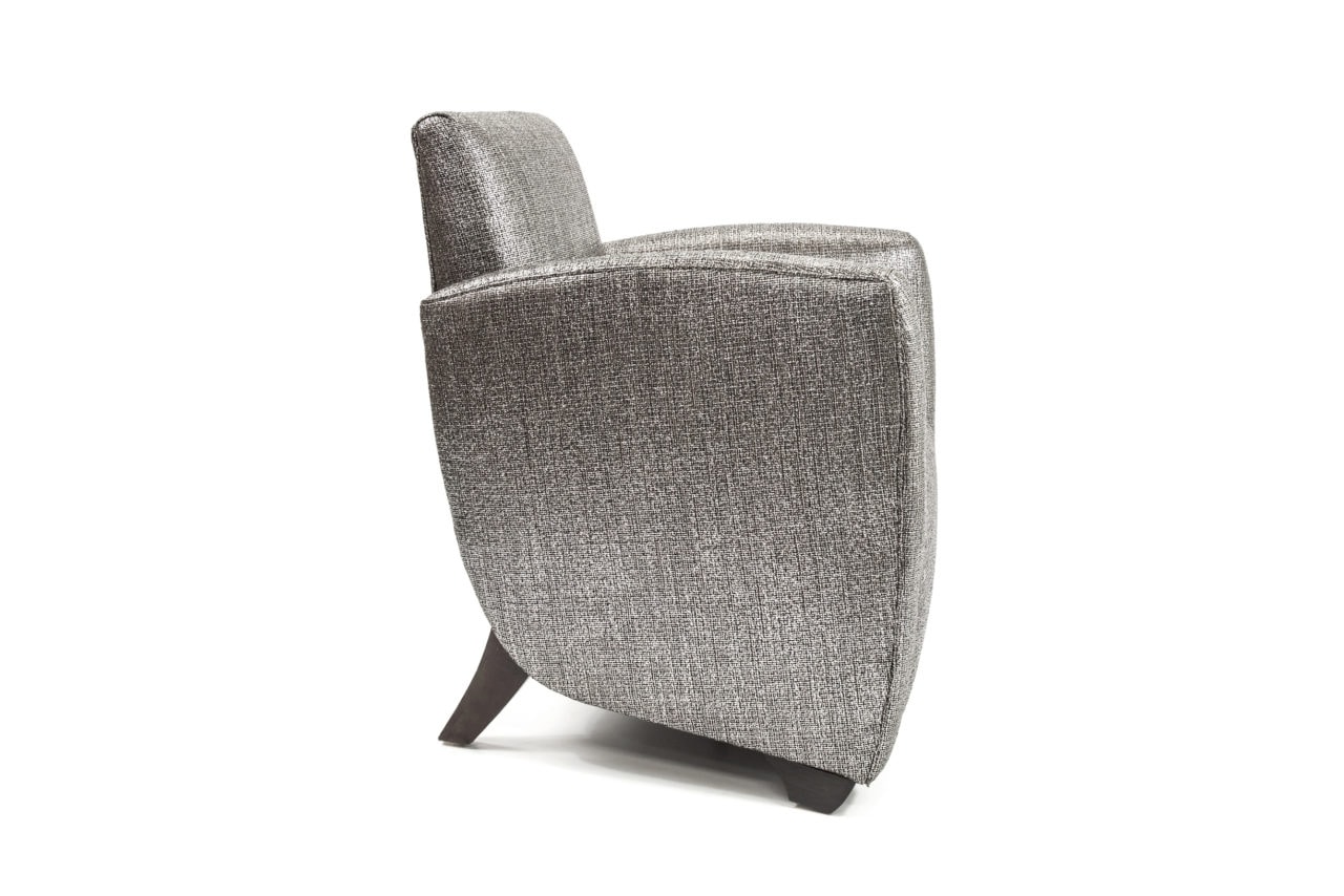 an upholstered SENTIENT contemporary designed arm chair with silver luxury fabric 
