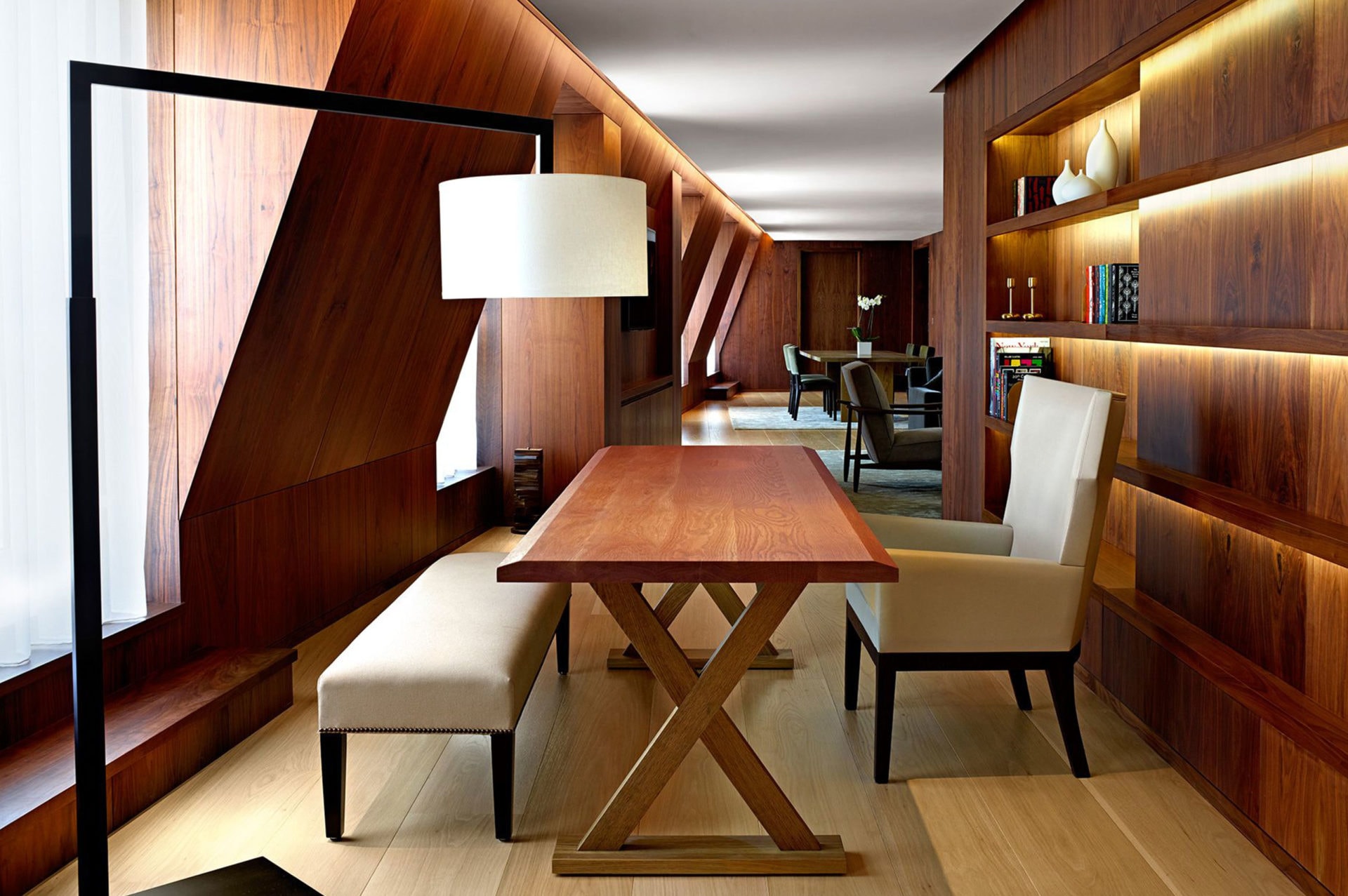 a custom SENTIENT contemporary designed wood table with luxury upholstered chair and bench in a London edition hotel room