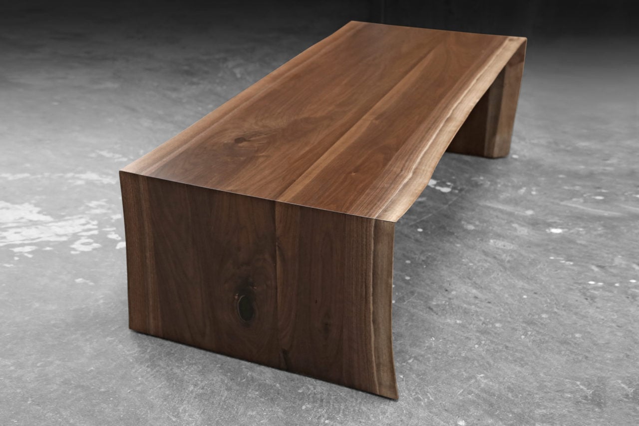 a contemporary designed walnut live edge solid wood waterfall end luxury coffee table 