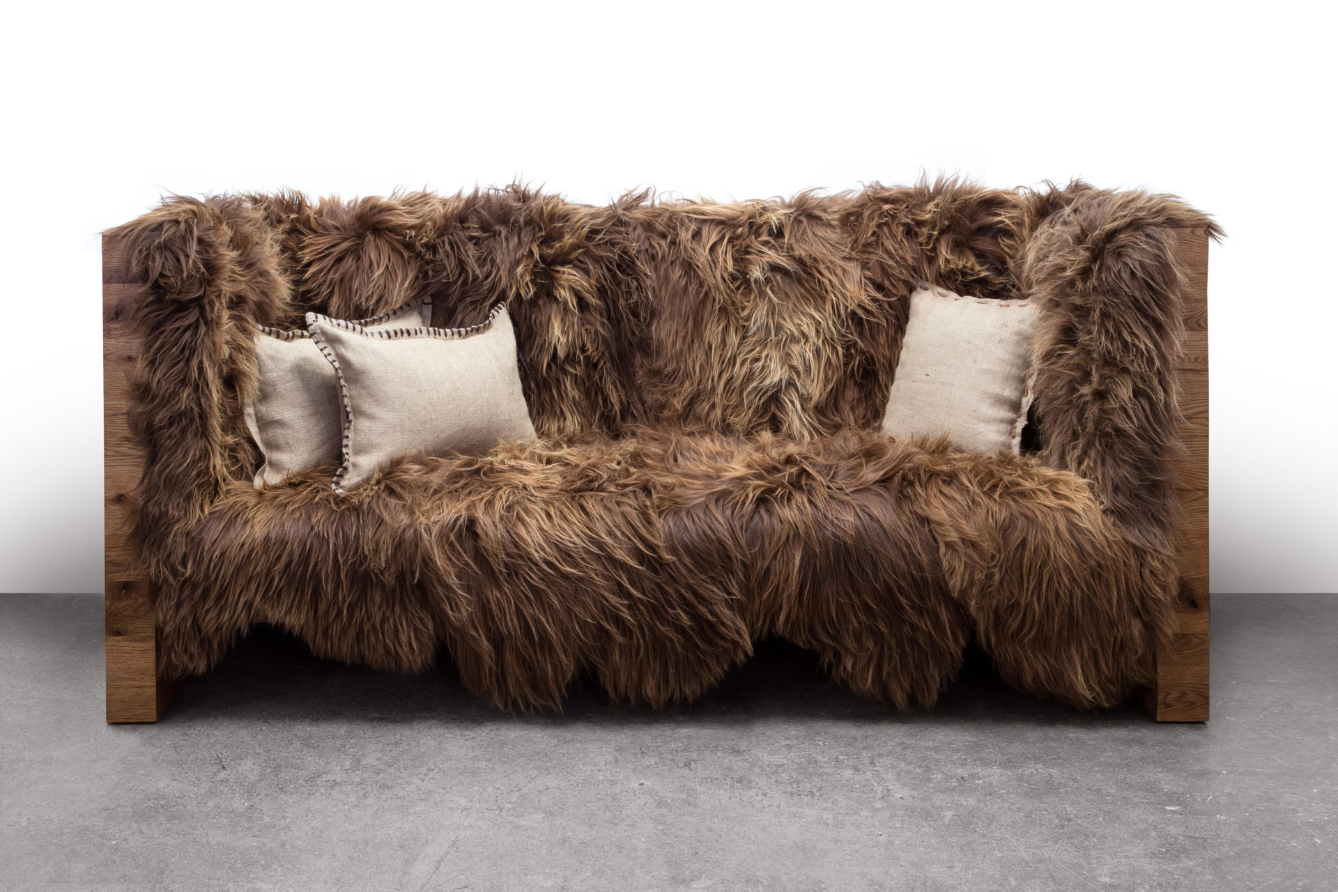 front view of a SENTIENT contemporary designed long wool sofa with luxury Icelandic long wool and reclaimed wood outer shell