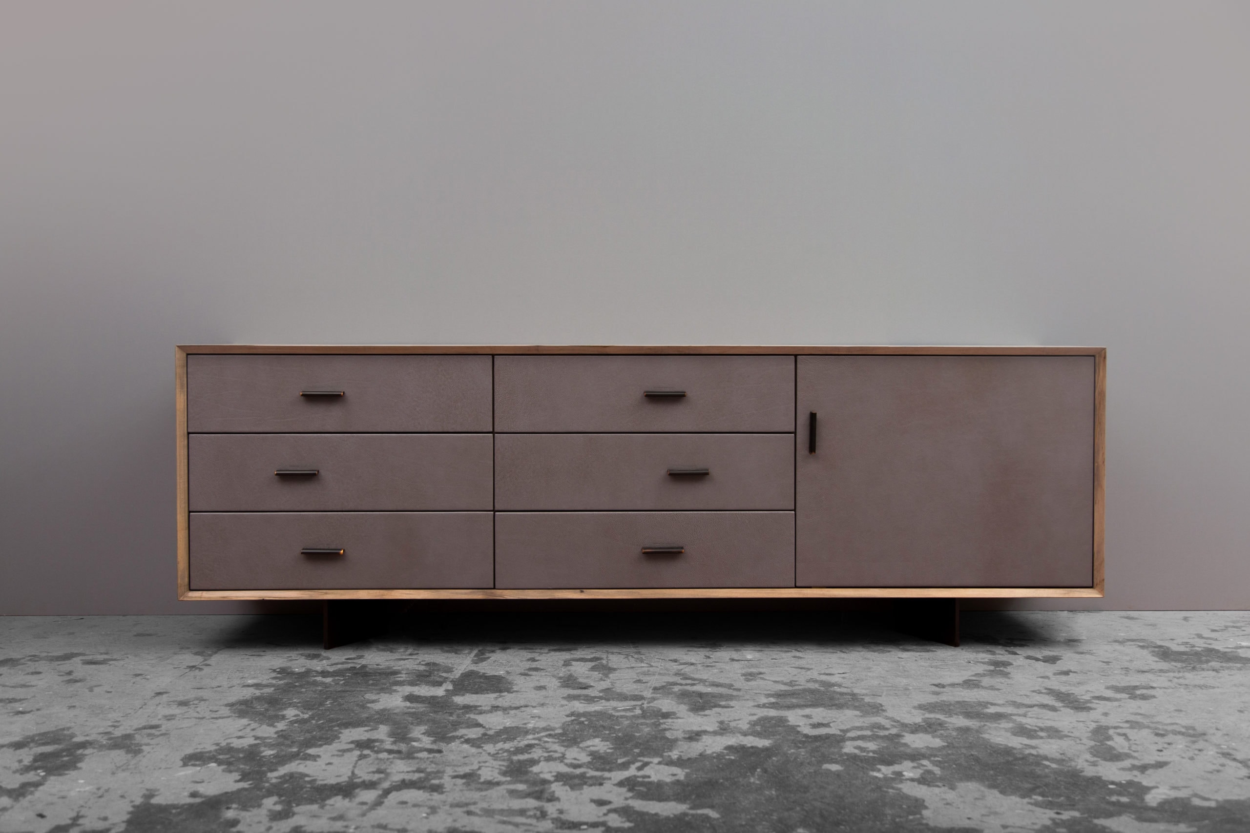 a custom SENTIENT contemporary designed murlough credenza dresser with maple wood shell and leather drawer fronts