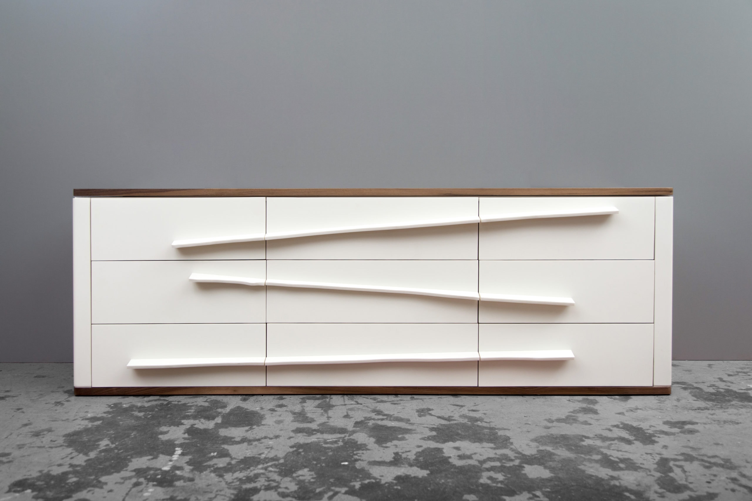 a custom SENTIENT contemporary designed Niagara dresser with white shell and elongated drawer pulls