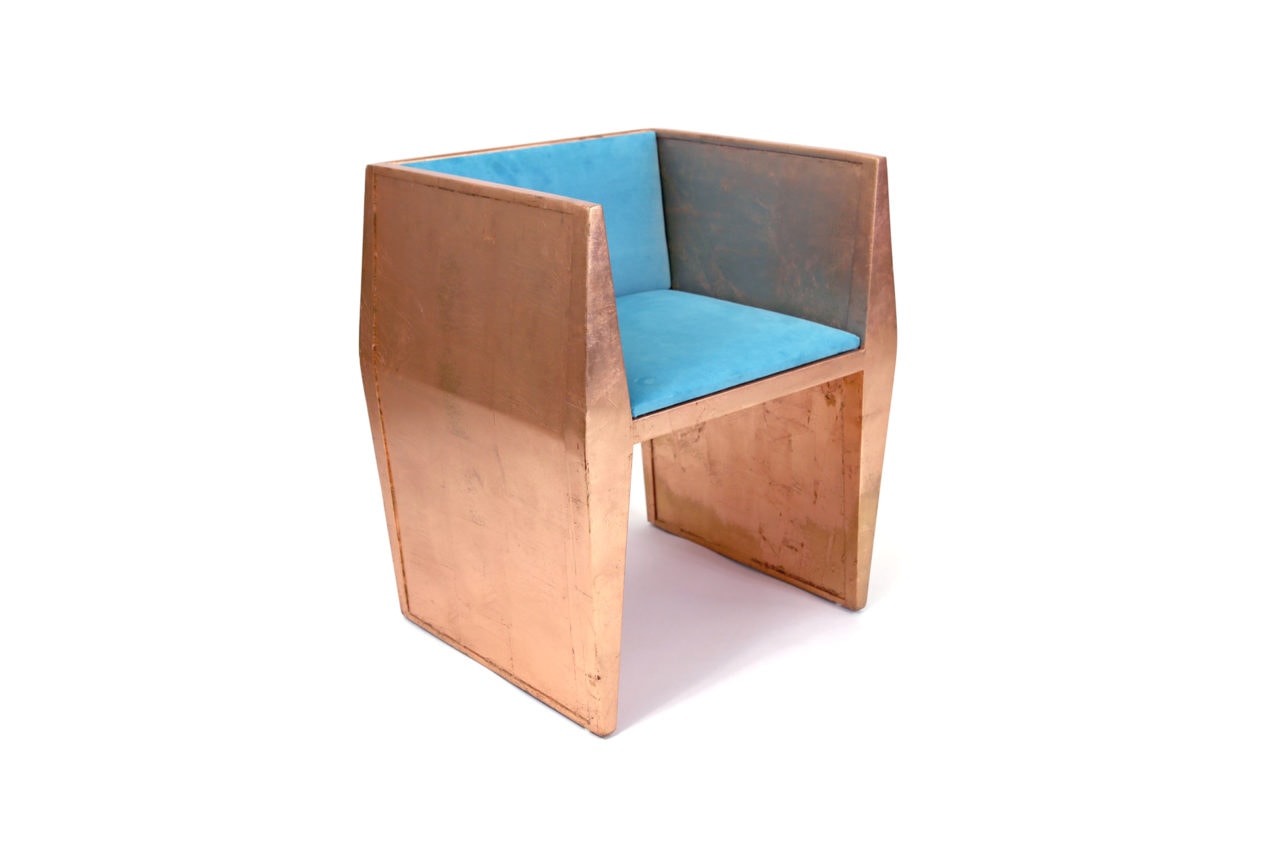 a contemporary designed SENTIENT sapience arm chair in walnut with turquoise luxury upholstered custom seat