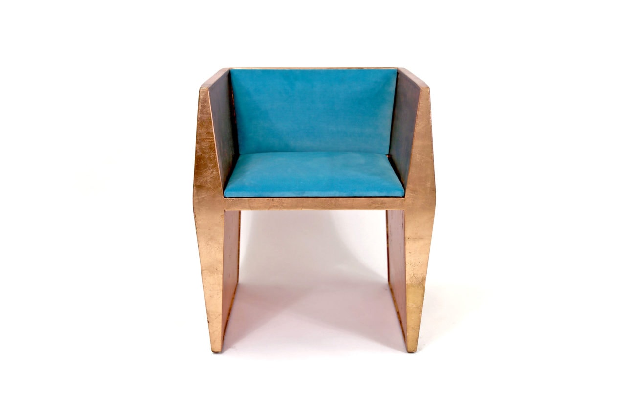 a frontal view of a contemporary designed SENTIENT sapience arm chair in walnut with turquoise luxury upholstered custom seat