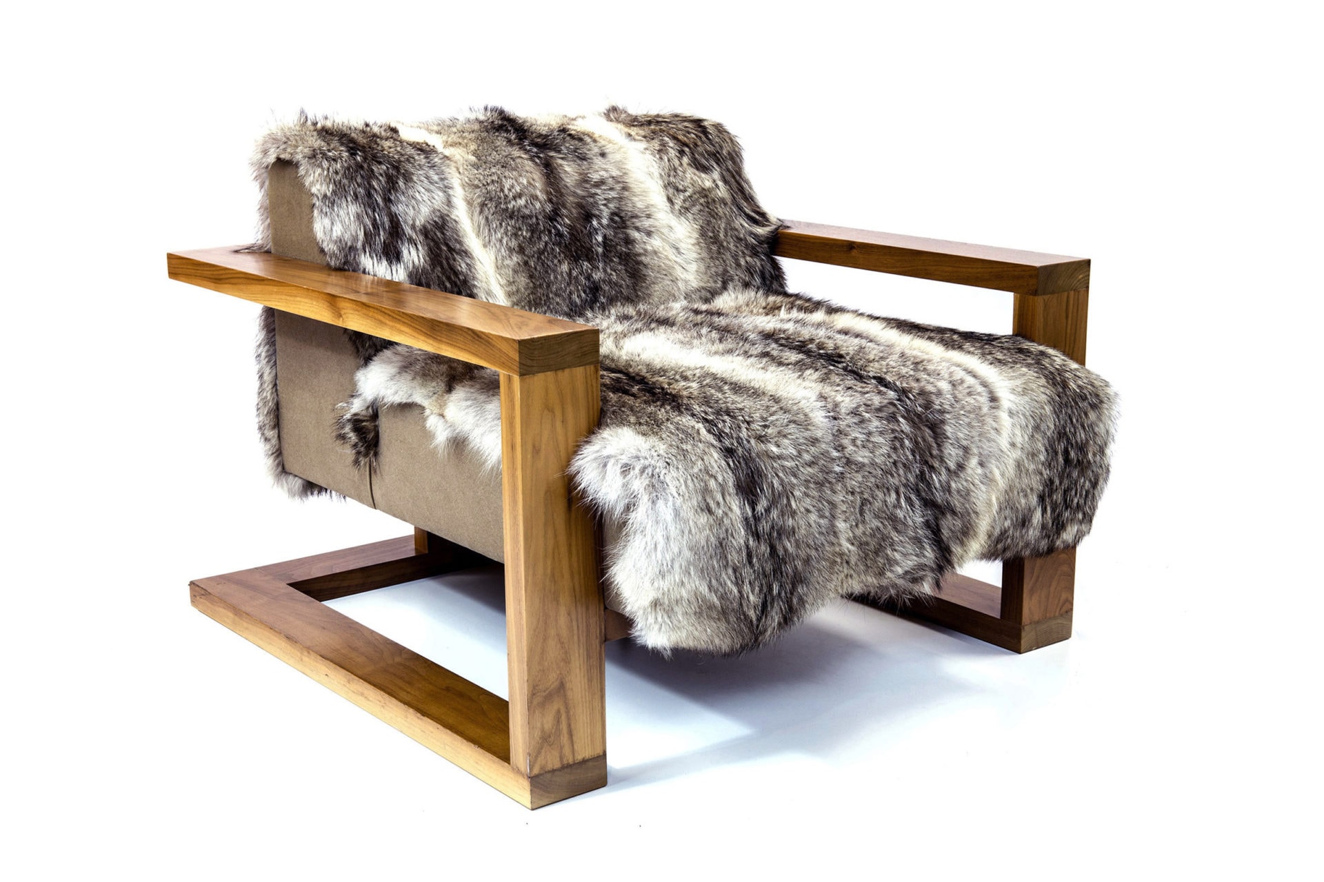 a SENTIENT contemporary designed upholstered Caribou custom lounge chair with wood arms and luxury fur 
