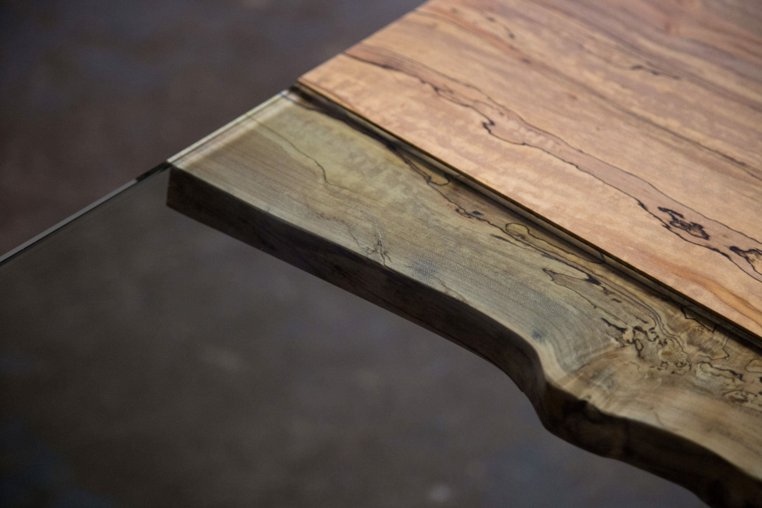 sentient_colorado_live_edge_details_4 Side view of an extra-long live edge Colorado dining table crafted from spalted maple, ideal for large spaces.