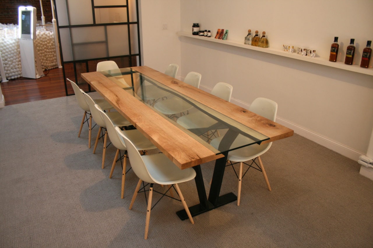 a SENTIENT contemporary designed Colorado table with custom glass inset and luxury chairs in an office setting 