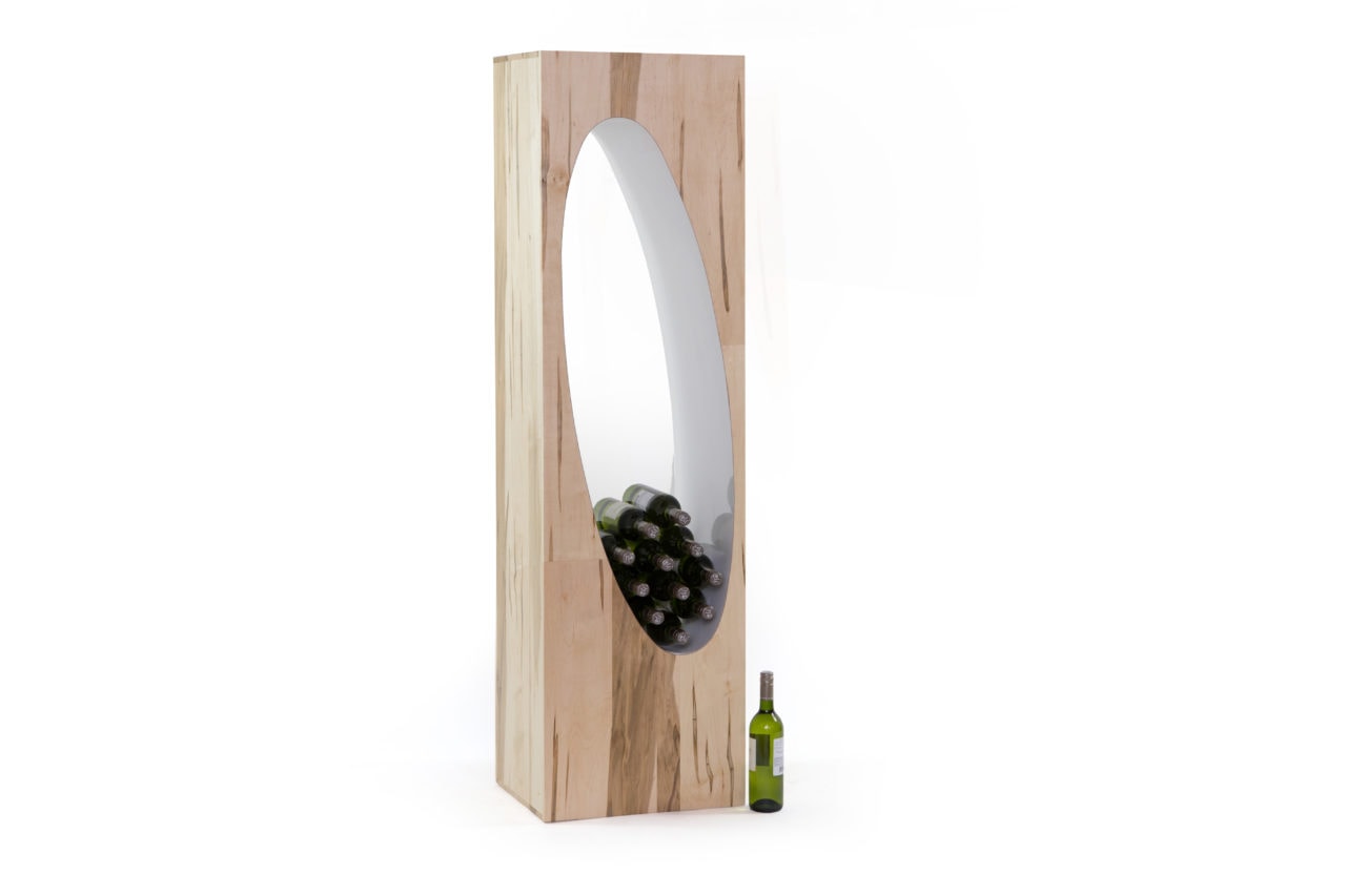 a SENTIENT contemporary vertical Orbit coffee table with bottles in oval cutout 