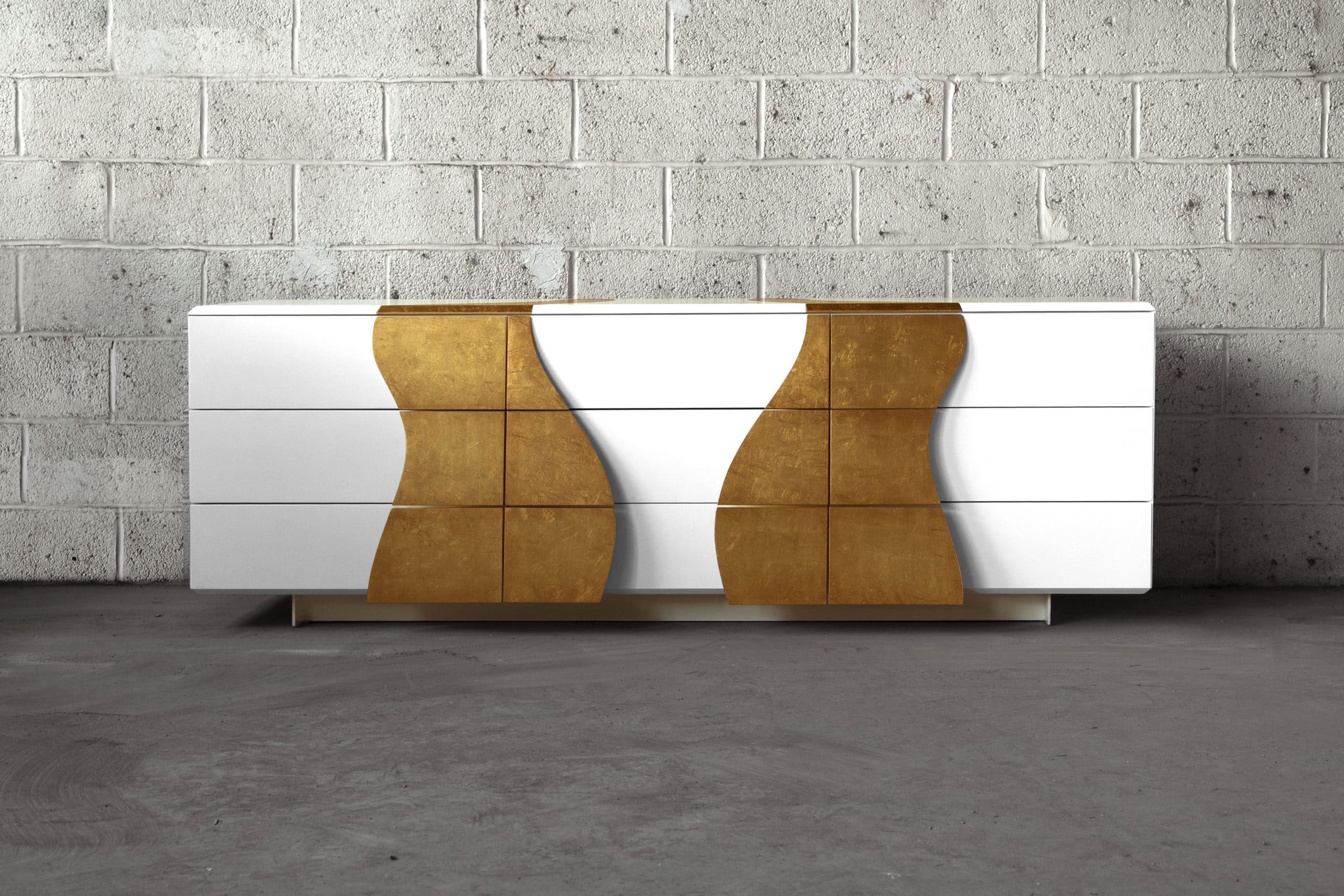 a custom SENTIENT contemporary designed Melodious console table with  gold leaf drawer pulls and matte white paint shell  