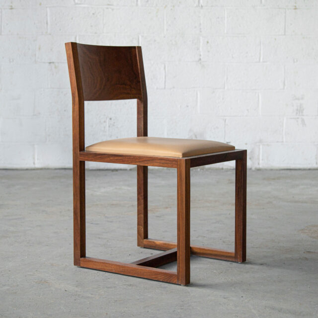 unique dining chairs in solid wood - The SENTIENT St. Lawrence chair embodies elegance in simplicity, with its clean, straight lines and natural wood finish. The thoughtful design includes a subtle backrest and a lightly cushioned seat, offering a harmonious blend of minimalist style and everyday comfort.