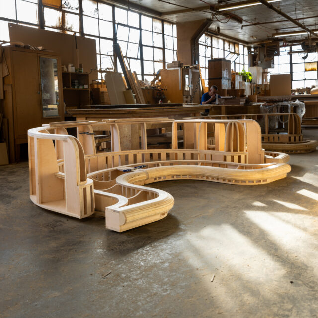 The frame of a custom made curved sofa at SENTIENT workshop