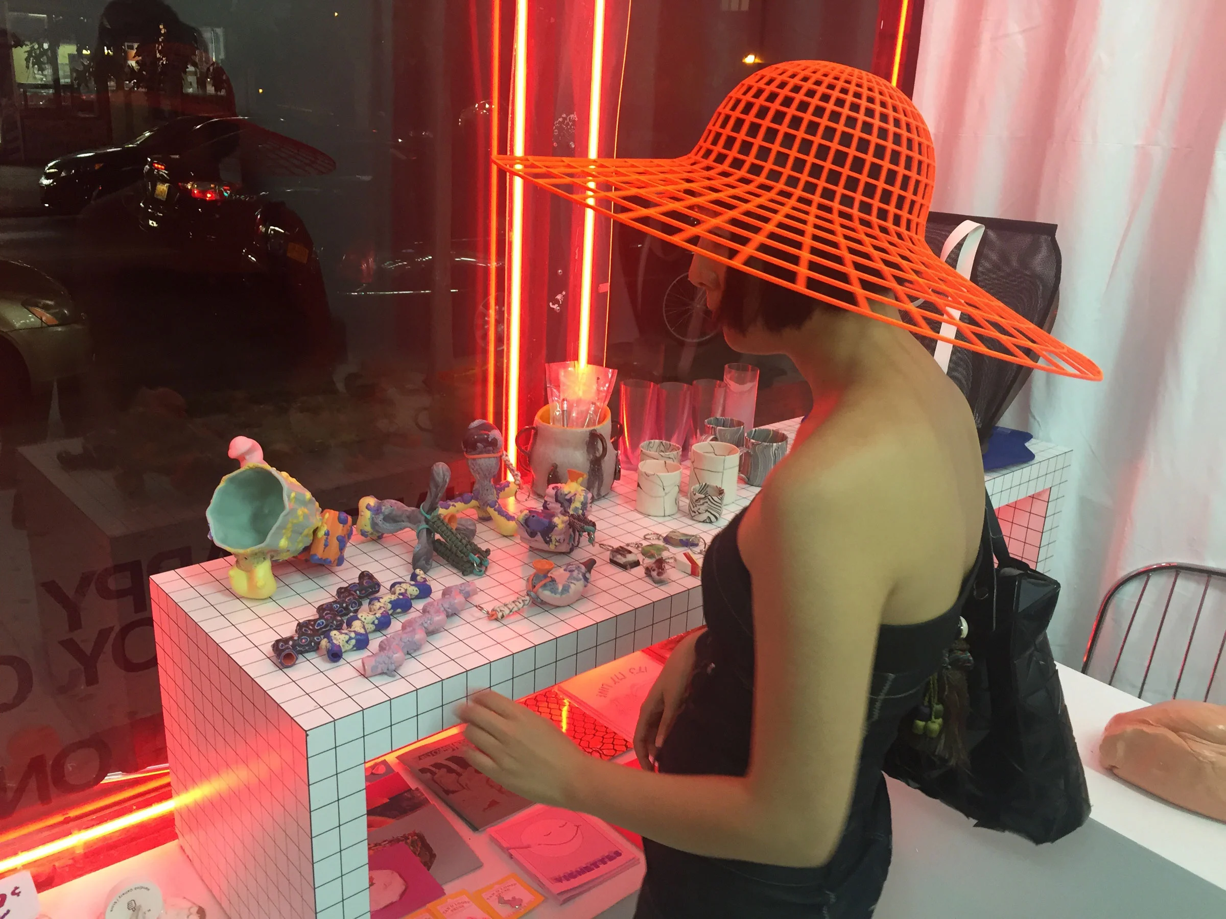 We attended the opening with hat designer Heidi Lee, pictured here with one of her creations