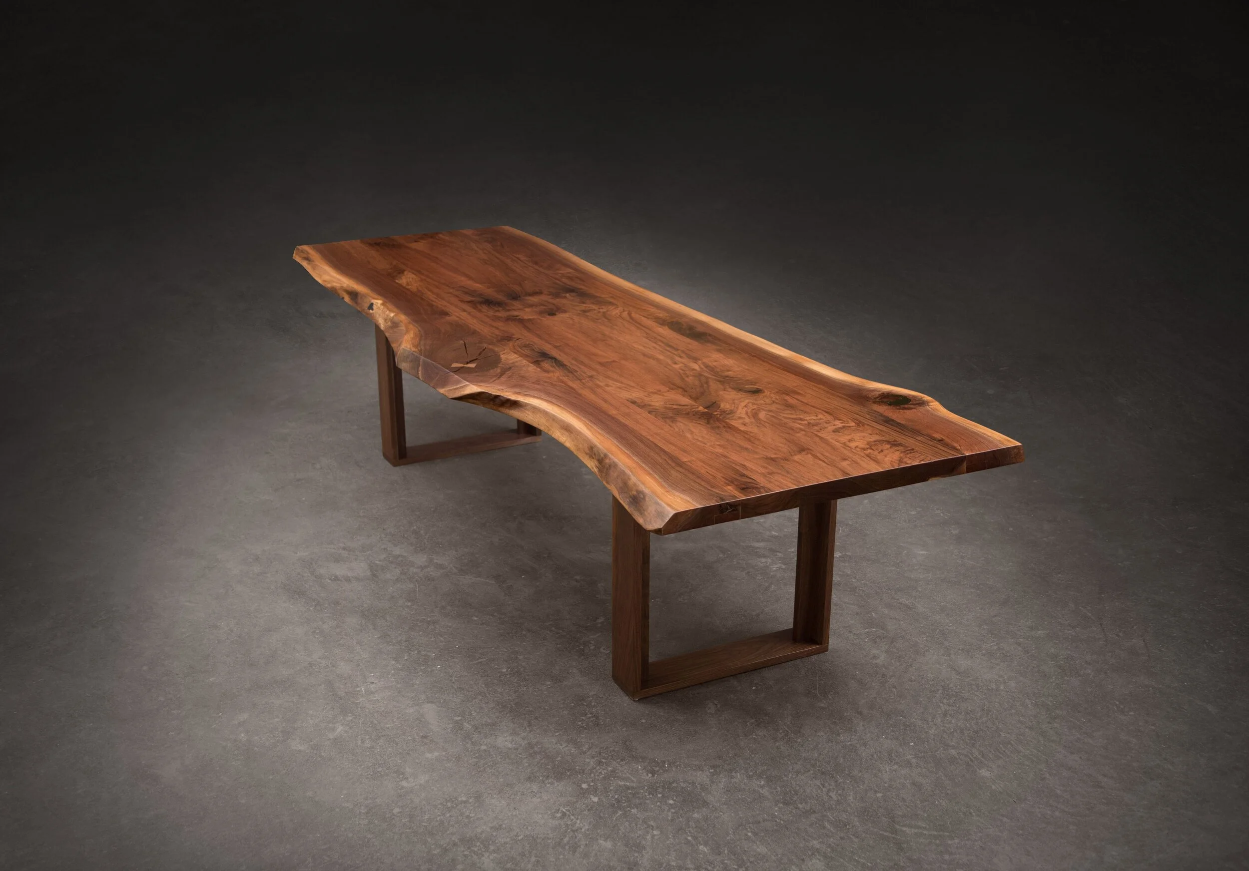 A SENTIENT Live Edge Table In American Black Walnut With Wood Frame Base