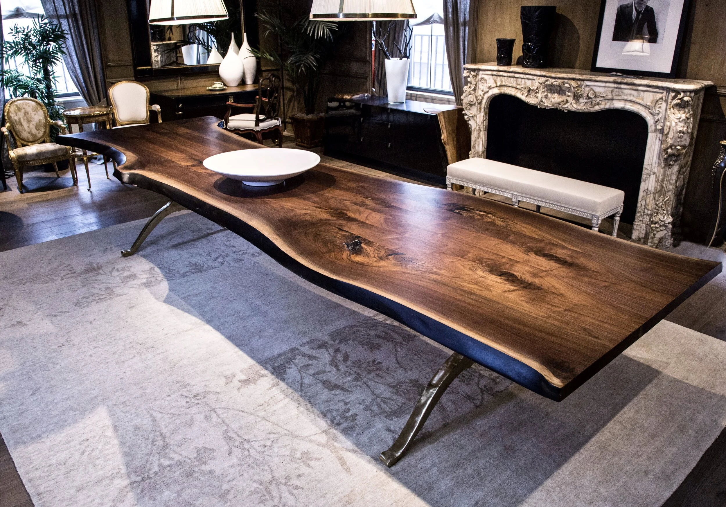 A SENTIENT Signature Live Edge Table In American Black Walnut With Polished Brass Wishbone Base