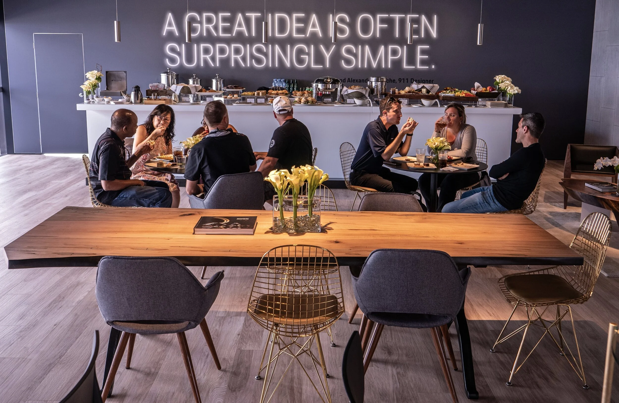 A SENTIENT Signature Live Edge Table Featured In A PORSCHE Car Show Display