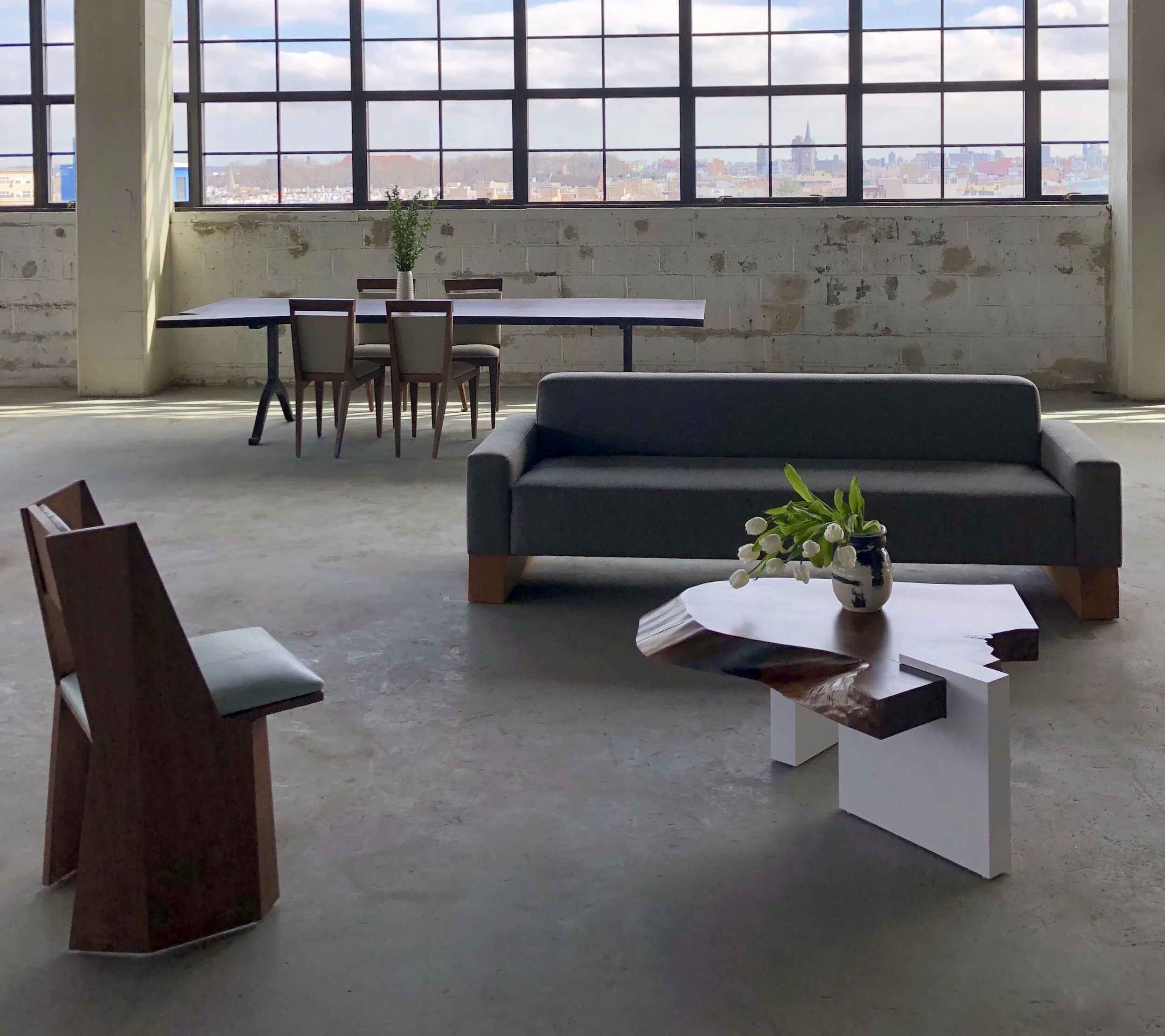 SENTIENT Symphony Chair , Live Edge Coffee Table , Beam Sofa , Live Edge Table , Angles Chair .