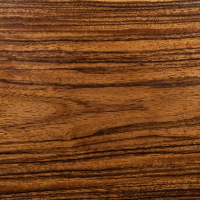 Tigerwood wood grain swatch showing natural color and texture - SENTIENT Materials